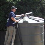 Dave cleaning a poly tank1182